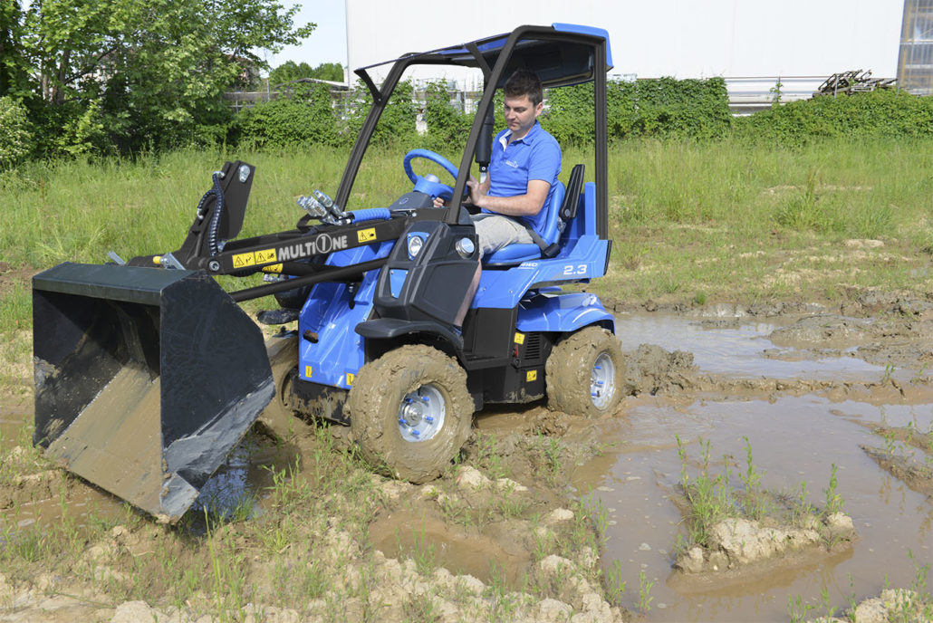 MultiOne mini loader 2 series with bucket on a muddy field