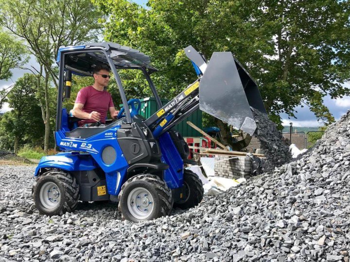 MultiOne mini loader 2 series with bucket moving debris
