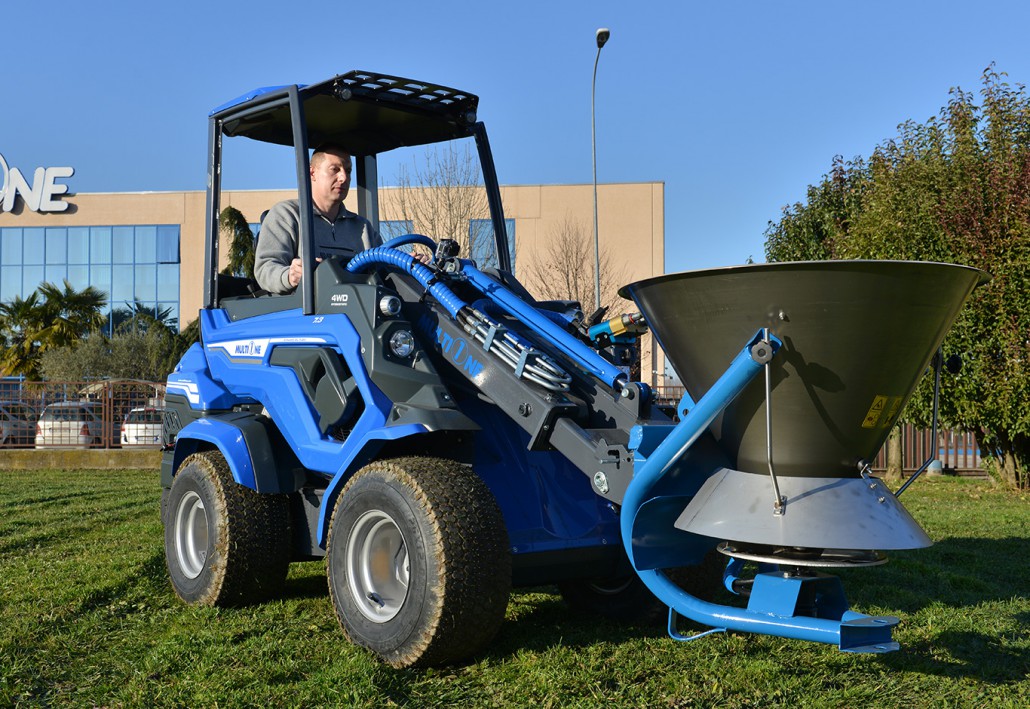 a salt and sand spreader parked in front of MultiOne venue.
