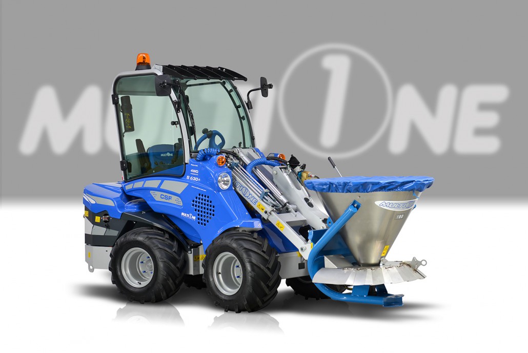 full view of a salt and sand spreader assembled on a mini loader