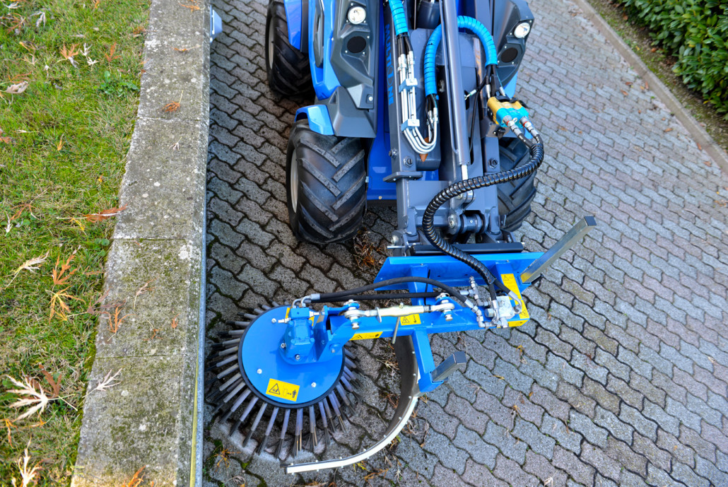 weed brush cleaning a street, seen from above